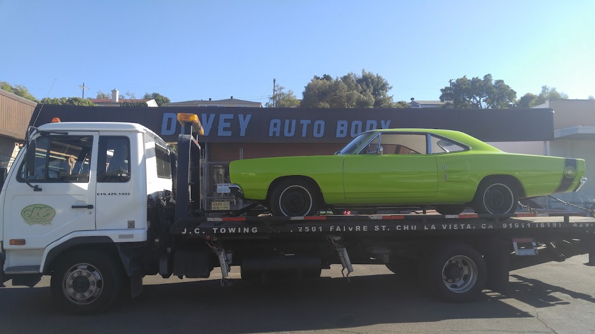 Lime-green classic delivered to the Davey Auto Body storefront